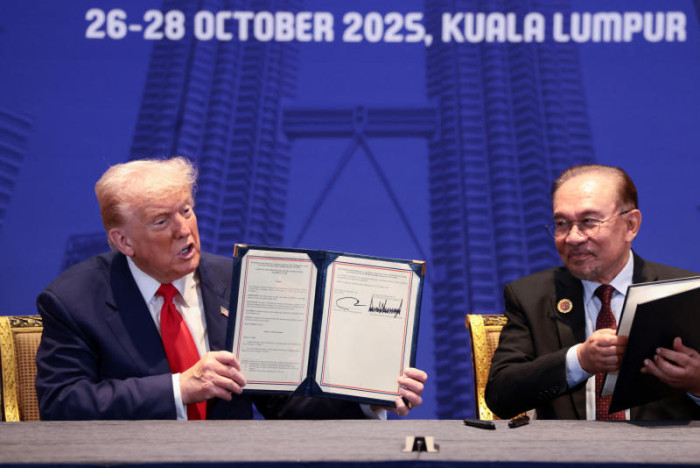 Trump signs trade deal with Malaysia’s Anwar during Asia trip