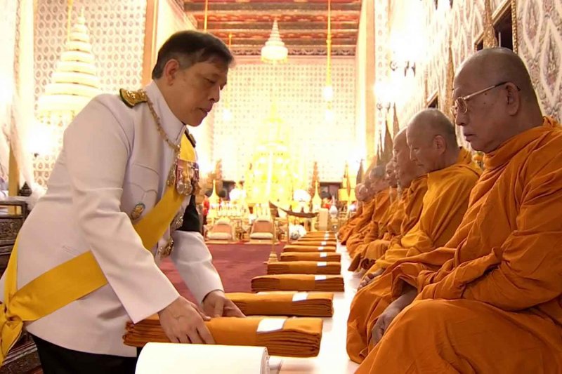 His Majesty the King on Sunday presents monastic robes in a solemn royal merit-making ceremony in honour of Her Majesty Queen Sirikit The Queen Mother at the Dusit Maha Prasat Throne Hall within the Grand Palace. TV Pool