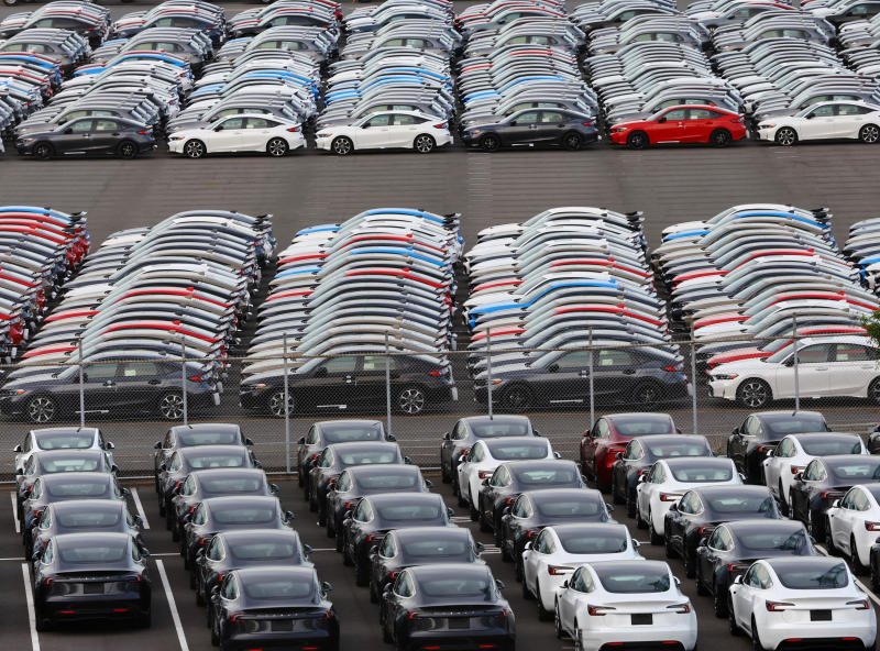 Honda and Tesla vehicles are lined up at a vehicle storage yard at an industrial port in Yokohama, near Tokyo, Japan, on July 23, 2025. (Photo: Reuters)