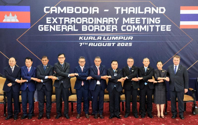 Gen Nattaphon Narkphanit (fifth from right), who was then deputy defence minister, and Cambodian Defence Minister Gen Tea Seiha (fifth from left), pose for a group photo with other delegates ahead of the Extraordinary General Border Committee meeting in Kuala Lumpur on Aug 7, 2025. (Photo: Pool/ Reuters)