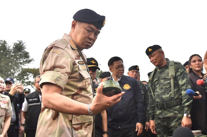 Prime Minister Anutin Charnvirakul inspects a previously recovered PMN-2 mine while receiving a briefing on border security at the 11th Infantry Battalion at Phu Makua in Kantharalak district of Si Sa Ket province on Tuesday. (Photo: Government House)