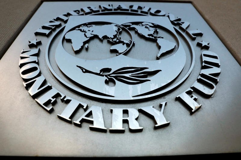 The International Monetary Fund logo is seen outside the headquarters building in Washington. (Photo: Reuters)