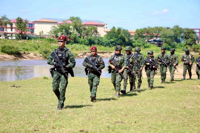 Thai soldiers patrol the border in Tak province on Sunday. Assawin Pinitwong