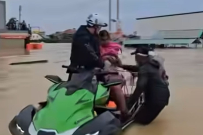 Jet ski champ rescues newborn and mother from floodwaters