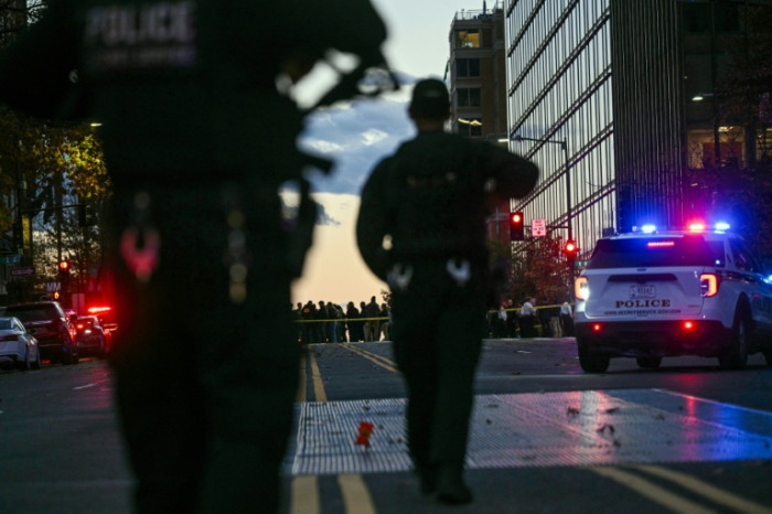 US halts asylum decisions as troop killing sparks migrant crackdown