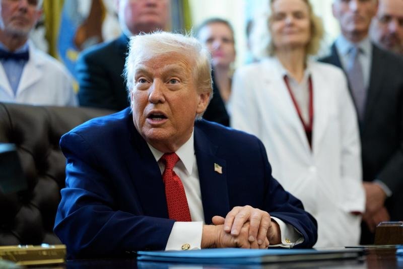 US President Donald Trump during an executive order signing in the Oval Office of the White House in Washington, DC, US, on Thursday. Trump on Thursday signed an executive order directing his administration to move cannabis into a less restrictive federal category, setting in motion a regulatory shift that could alter the legal and commercial landscape for the drug nationwide. (Bloomberg photo)