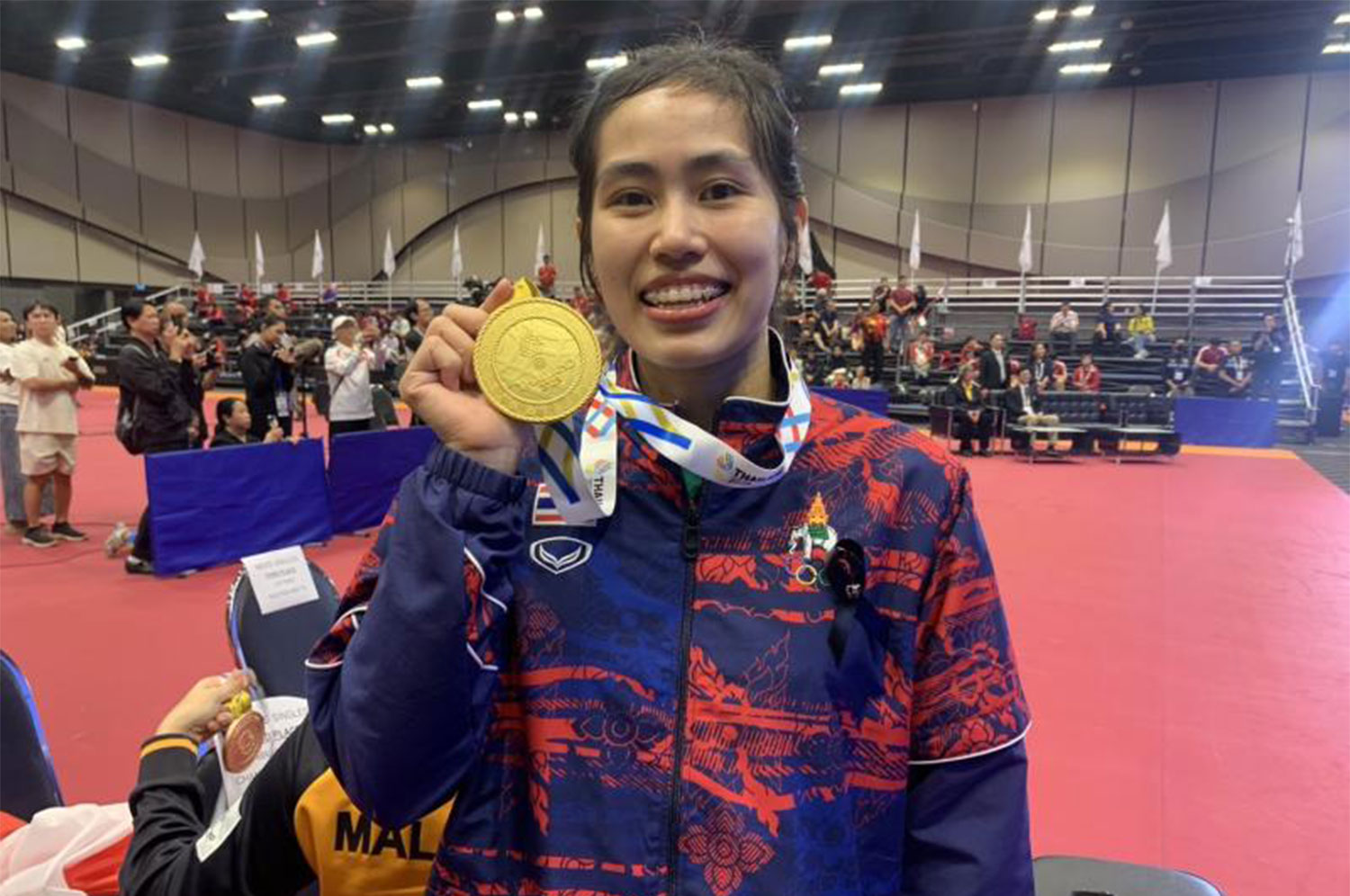 Hat-trick of titles: Table tennis player Suthasini Sawettabut poses with her gold medal.  