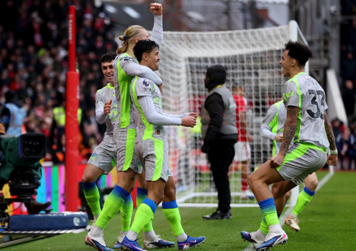 Man City go top with 2-1 win at Forest