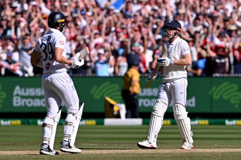England’s Jamie Smith (left) and Harry Brook celebrate after seeing England to a four-wcket victory in the fourth test in Melbourne on Saturday. (Photo: AFP)