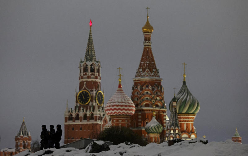 Law enforcement officers stand guard near the Spasskaya tower of the Kremlin and St Basil's Cathedral during New Year celebrations in central Moscow, Russia, on Dec 31, 2025. (Photo: Reuters)