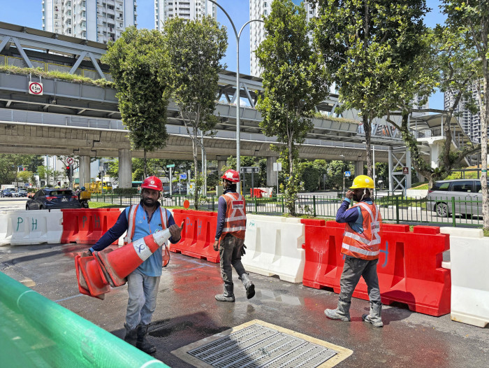 Singapore trying to improve conditions for low-paid migrants