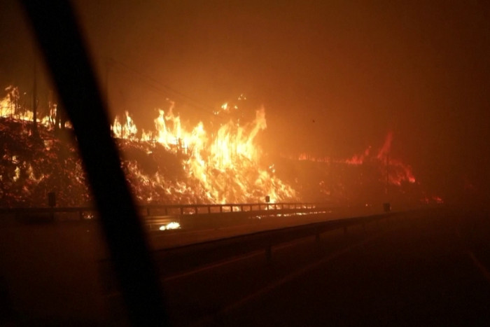 Neighborhoods burn as wildfires tear through southern Chile