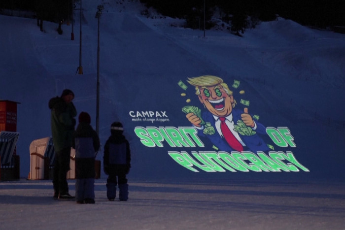 Activists use Trump ski slope projection to denounce Davos meeting