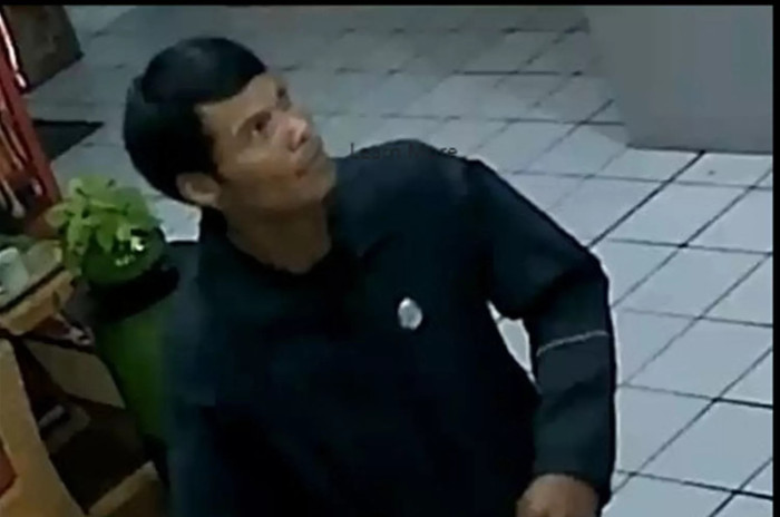 Manhunt after hotel receptionist beaten to death