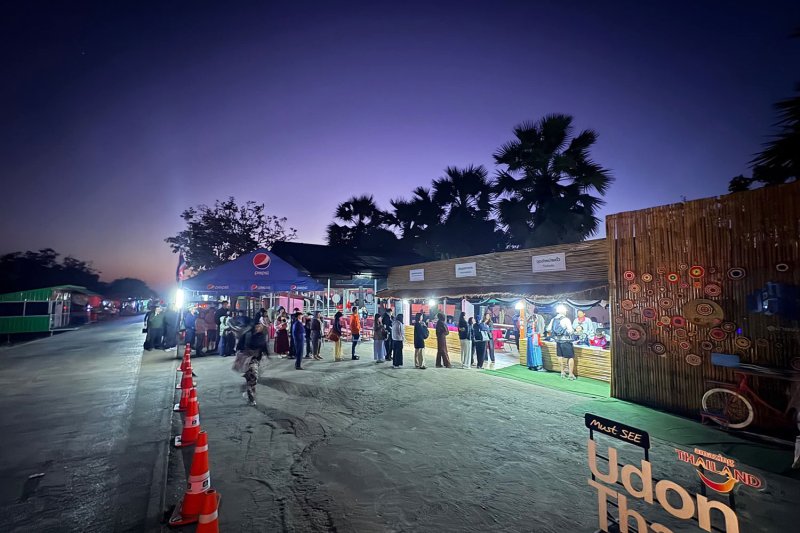 Visitors line up before dawn to buy boat tickets for an early‑morning view of the blooming red lotus fields on the lake. (Photo: TAT Udon Thani)