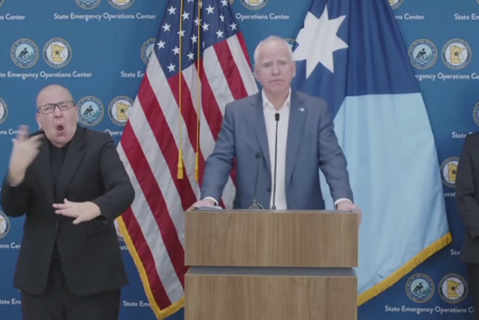 Walz: officials tried to &lsquo;sully' name of man shot by federal agent