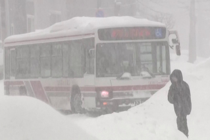 Record snow buries roads and grounds flights in northern Japan