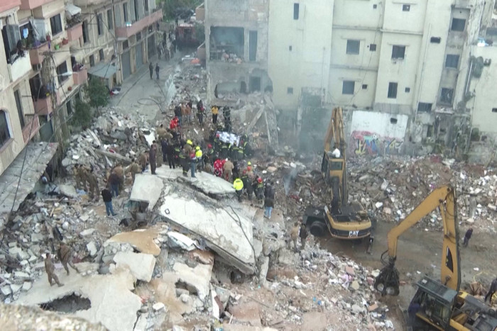 Rescue workers pull bodies from Lebanon building collapse