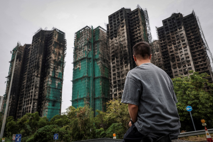 Hong Kong offers buyouts for homes damaged in deadly fire