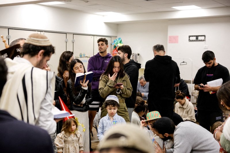 Israelis gather in a bomb shelter in Tel Aviv after missiles were launched towards Israel from Iran following strikes by Israel and the US on Tehran, on Feb 28, 2026. (Photo: Reuters)