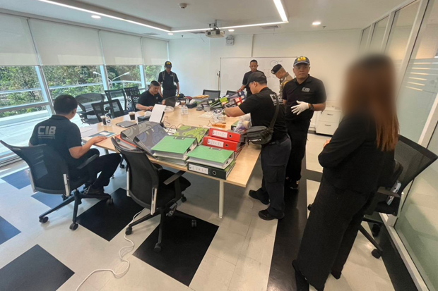 Police search one of the six raided premises places for evidence against Ben Smith, alias Benjamin Maurerberger, and his wife on Monday. (Photo: Central Investigation Bureau via Wassayos Ngamkham)