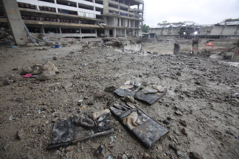 Construction gloves at the collapsed State Audit Office building in Bangkok. (Photo: Pattarapong​ Chatpattarasill)
