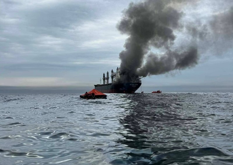 Smoke rises from the MV Mayuree Naree after it was struck by two Iranian missiles on March 11 in the Strait of Hormuz.