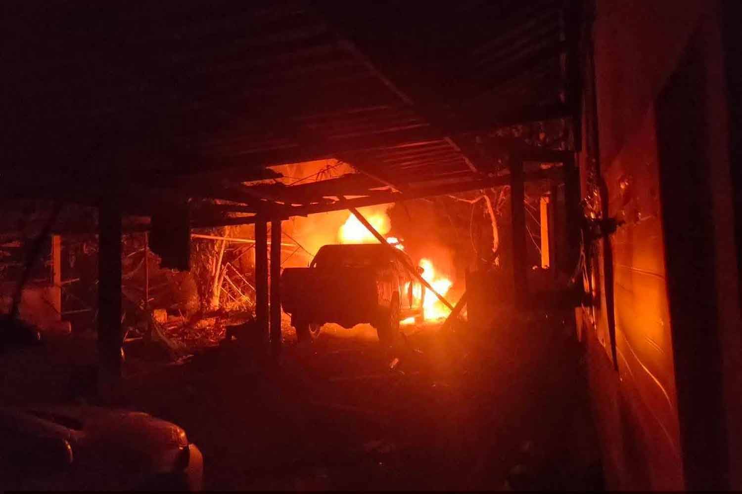 Fire erupts after a bomb attack in Panare district Tuesday evening.