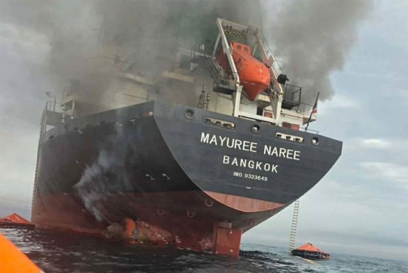 Smoke pours from the Thai-flagged bulk carrier Mayuree Naree after it was attacked in the Strait of Hormuz on March 11. The vessel has since drifted into Iranian waters with three crew members believed to be still aboard. (Photo: Royal Thai Navy spokesperson)