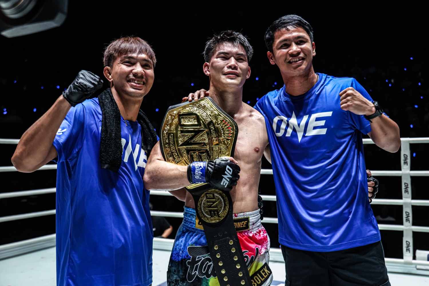 Rambolek celebrates with his coaches, including Superbon (right) at ONE Friday Fights 147