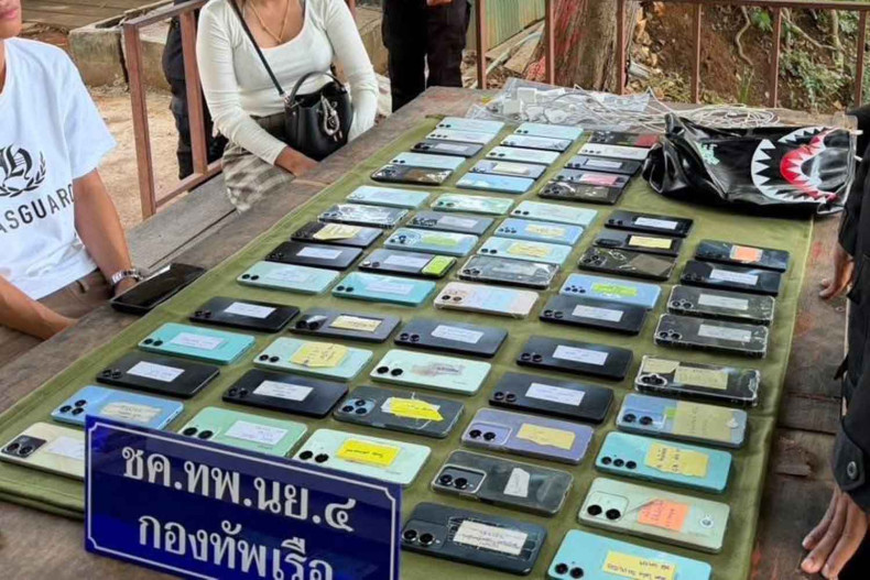 Two caught with 64 phones used by scammers