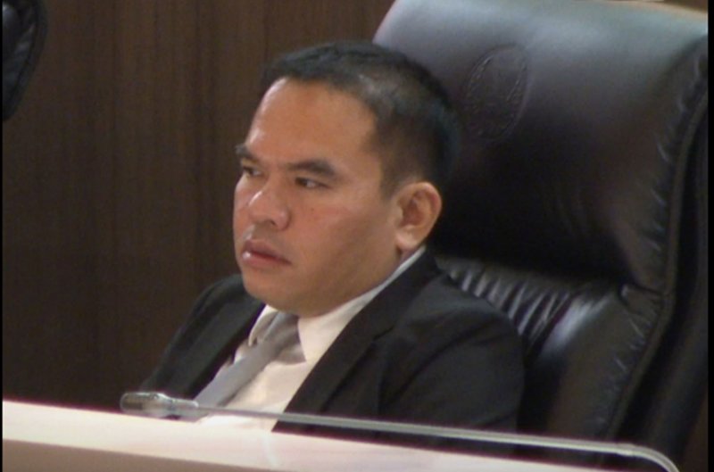 Suriya Wong-aree, People’s Party MP for Udon Thani’s Constituency 7 and its first so-called 'cobra,' sits among MPs from the ruling Bhumjaithai Party during a House session on Wednesday. (Screen capture ONE News31 Channel)