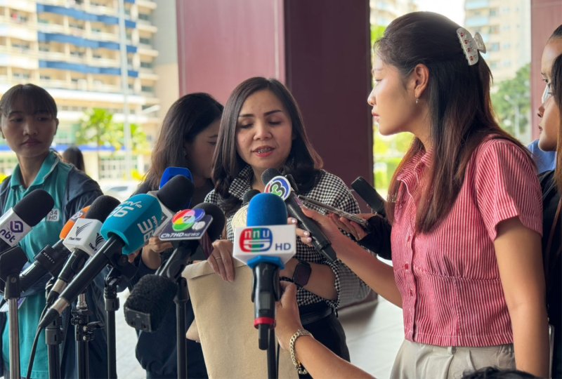 A representative of V.A. Oil Co Ltd speaks to reporters after meeting with investigators on Wednesday to submit fuel transport documents and tax invoices. (Photo supplied/Wassayos Ngamkham)