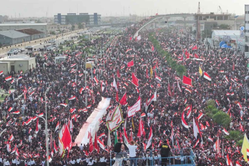 A drone view of supporters of Iraqi Shi'ite cleric Muqtada al-Sadr taking part in a peaceful protest against U.S. and Israeli actions in the region, amid the U.S.-Israeli conflict with Iran, in Basra, Iraq, April 4, 2026. REUTERS