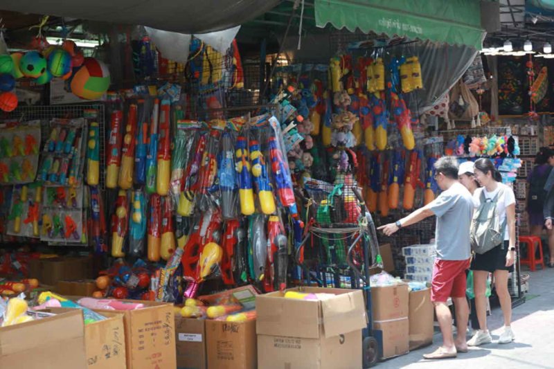 Songkran accessories — including water guns and goggles — are now available at Sampheng Market ahead of the Thai New Year festival. Apichart Jinakul