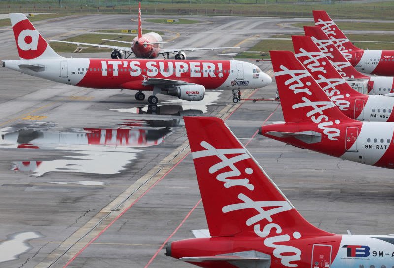 AirAsia planes stand on the tarmac at Kuala Lumpur International Airport Terminal 2 in Sepang, Malaysia, on Jan 21. (Photo: Reuters)