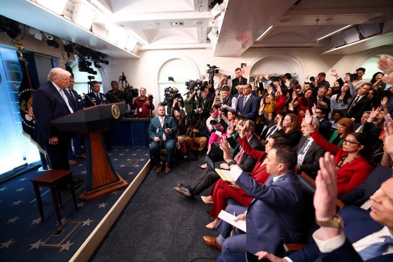 Members of the media raise hands to ask questions during a press conference held by US President Donald Trump at the White House in Washington on Monday. (Photo: Reuters)