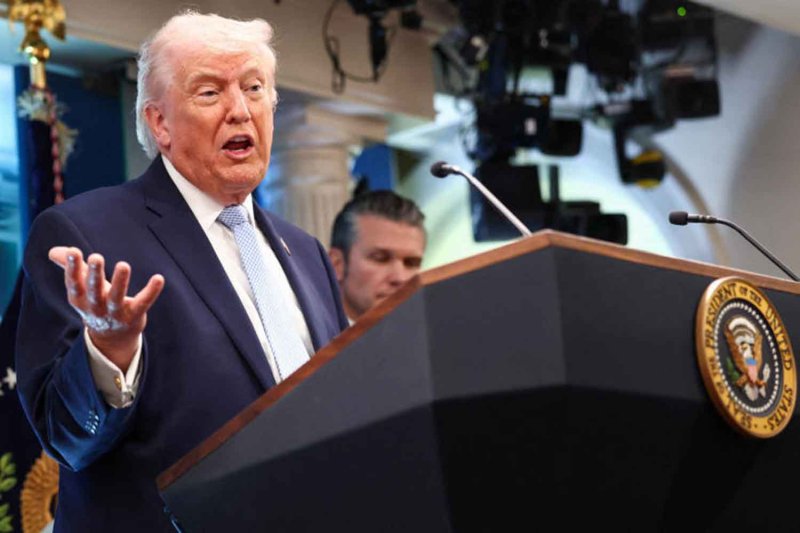 U.S. President Donald Trump, flanked by Secretary of Defense Pete Hegseth, speaks during a press conference in the James S. Brady Press Briefing Room at the White House in Washington, D.C., U.S., April 6, 2026. REUTERS