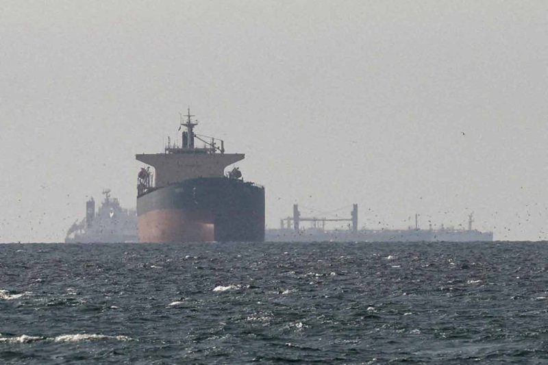 Cargo ships in the Gulf, near the Strait of Hormuz, as seen from northern Ras al-Khaimah, near the border with Oman’s Musandam governance, amid the U.S.-Israeli conflict with Iran, in United Arab Emirates, March 11, 2026. REUTERS