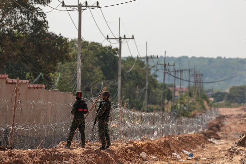Thai soldiers stand guard outside scam compounds which Thai military said were used for scam operations in the O’Smach area at the Chong Chom–O’Smach border crossing after clashes between Thailand and Cambodia along a disputed border area, in Samraong, Oddar Meanchey province, Cambodia, on Tuesday. (Photo: Reuters)