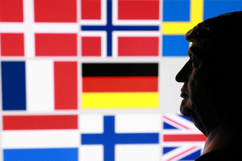 A 3D-printed miniature model of US President Donald Trump and flags of eight European countries potentially facing US tariffs after Trump said he may put a tariff on countries that do not support his plan for the United States to control Greenland, in this illustration taken on Jan 17, 2026. (Photo: Reuters)