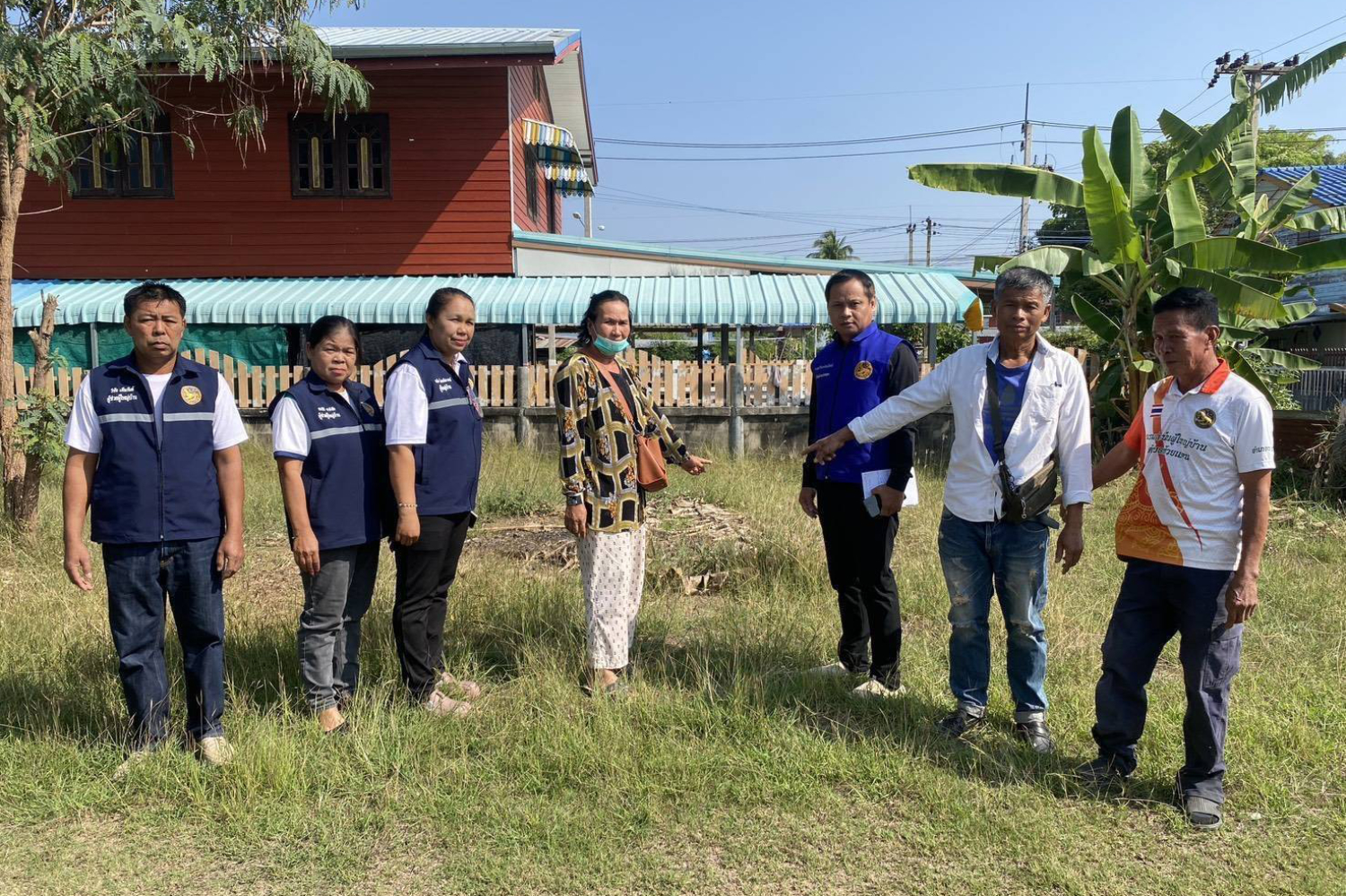 Officials in Korat point at an area in Huai Thalaeng district, empty of the house where many Chinese children and mothers were claimed to live in. 