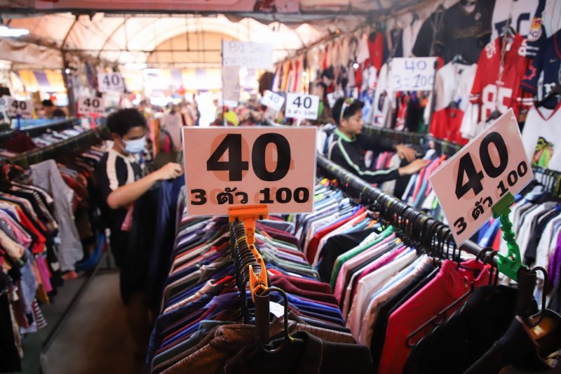Shoppers check out secondhand clothing at the Patthavikorn Market in Bangkok. (Photo: Varuth Hirunyatheb)