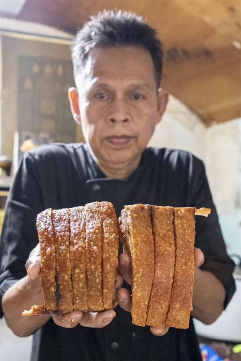 Chef Ka’s unique six‑layer crispy pork in Bangkok slum draws queues of up to three hours