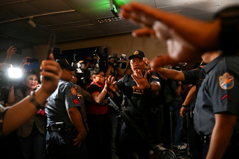 Police personnel arrive as people react to the gunshots heard inside the Senate of the Philippines in Pasay, Metro Manila on May 13, 2026. (Photo: AFP)