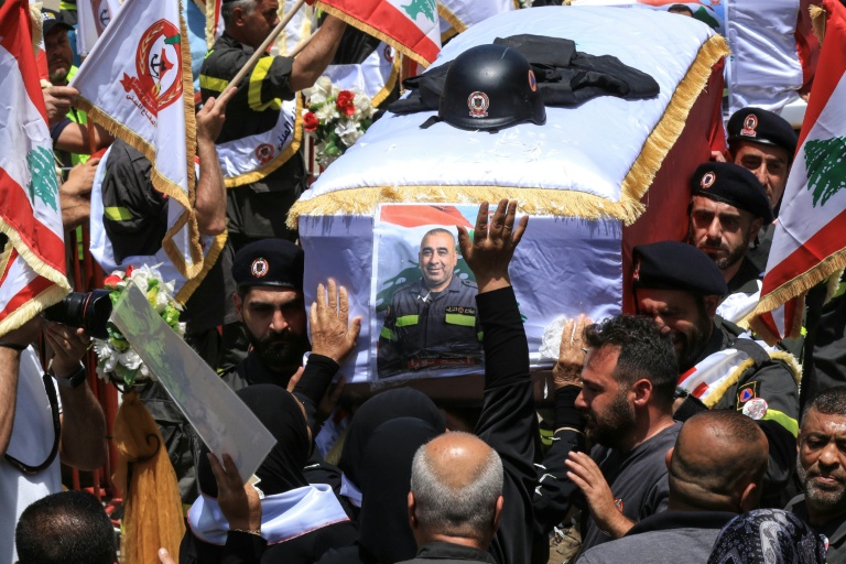 Fellow rescuers carry the coffins of two civil defence members who Lebanon said were killed in Israeli airstrikes. (Photo: AFP)
