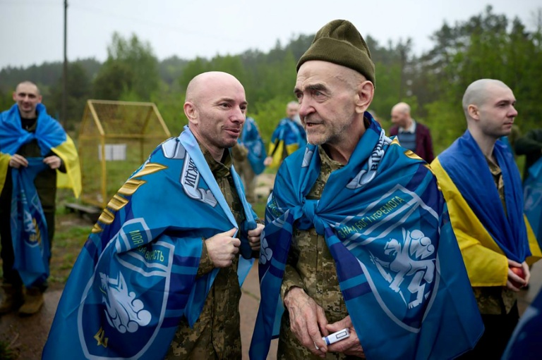 Released Ukrainian prisoners of war gather following an exchange at an undisclosed location in the Chernihiv region on May 15, 2026. Prisoner swaps are one of the few remaining areas of cooperation between the two sides. (Photo: AFP)