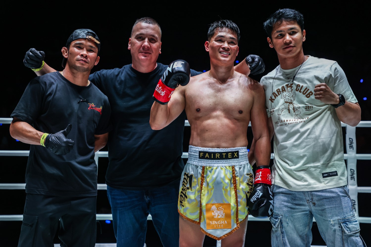 Superbon celebrates with Petchtanong after cornering his teammate in a victory at ONE Fight Night 43