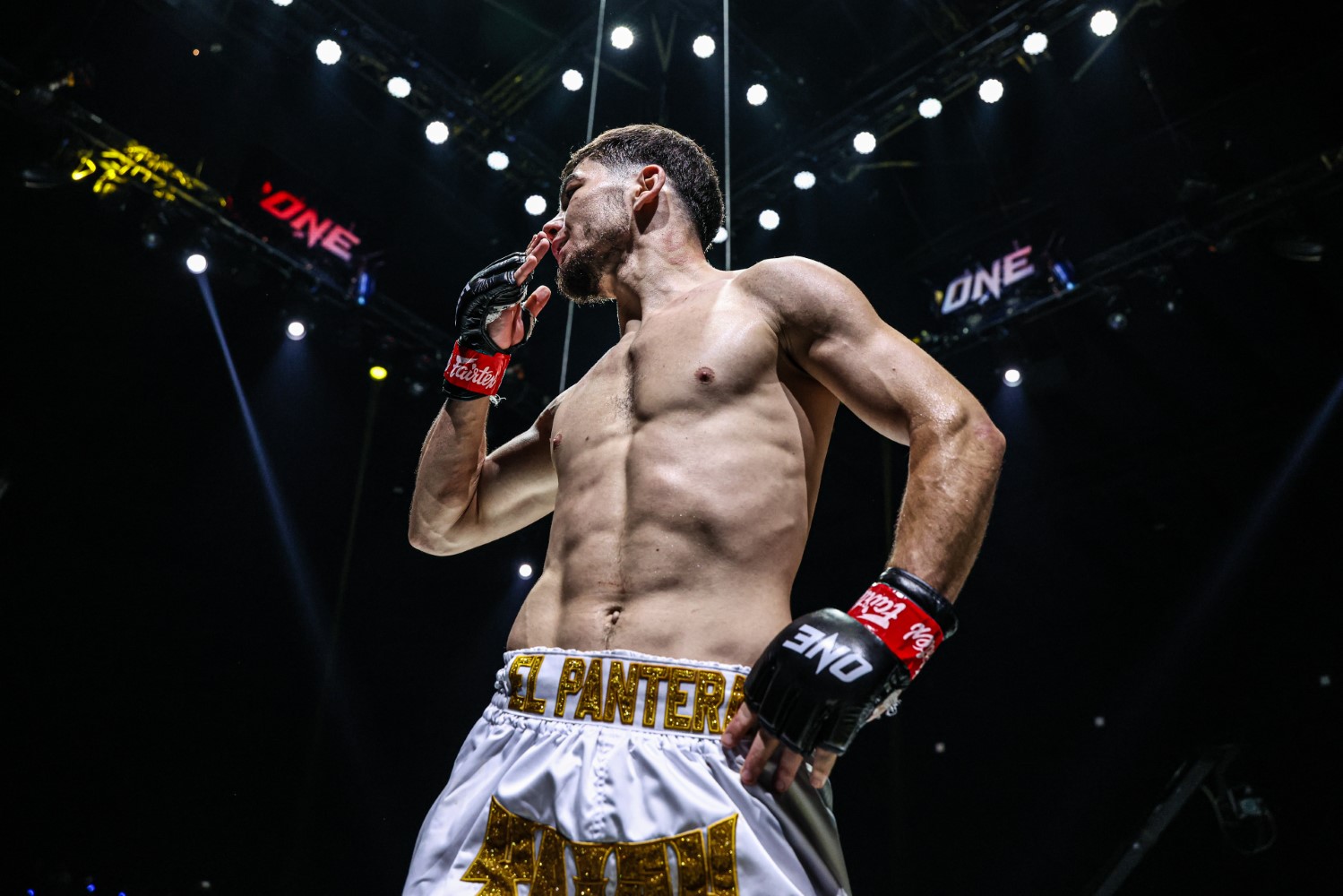 Aslamjon Ortikov gestures to the Lumpinee Stadium crowd after stopping Jordan Estupinan at ONE Fight Night 43
