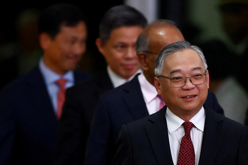 Singapore's Deputy Prime Minister Gan Kim Yong, right, and cabinet ministers attend their swearing-in ceremony at the Istana, in Singapore, on May 23, 2025. (File photo: Reuters)